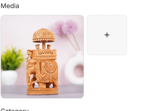 Hand-carved wooden elephant figurine with decorative howdah and intricate Rajasthani carvings