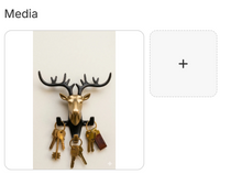 Gold and black deer head wall-mounted key holder with antlers and multiple hooks for keys