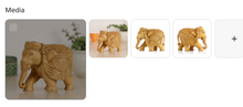 Handcrafted wooden elephant figurine with circular medallion and floral caparison carvings shown in lifestyle setting and from front and side angles