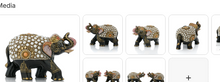 Black decorative elephant figurine with white pearl dot mosaic pattern and gold floral accents shown individually and as a pair from multiple angles